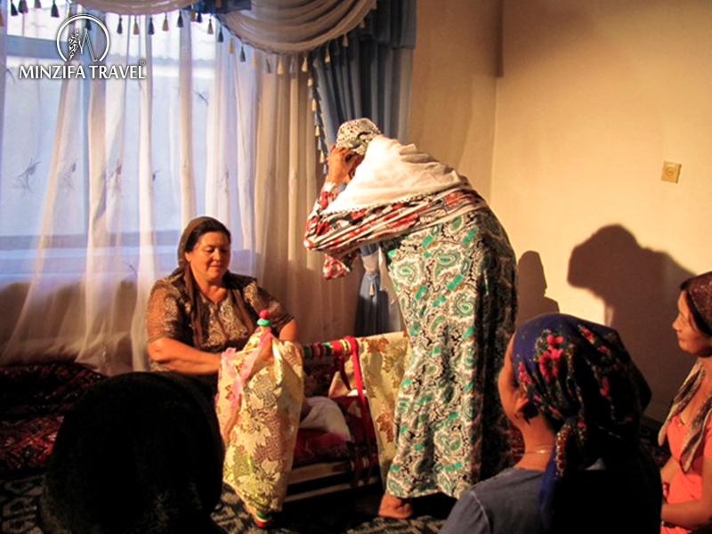 Beshik-tui - the first swaddling of a baby