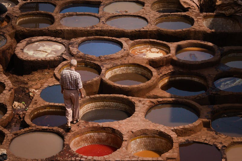 free-photo-of-high-angle-shot-of-a-man-walking-around-a-tannery